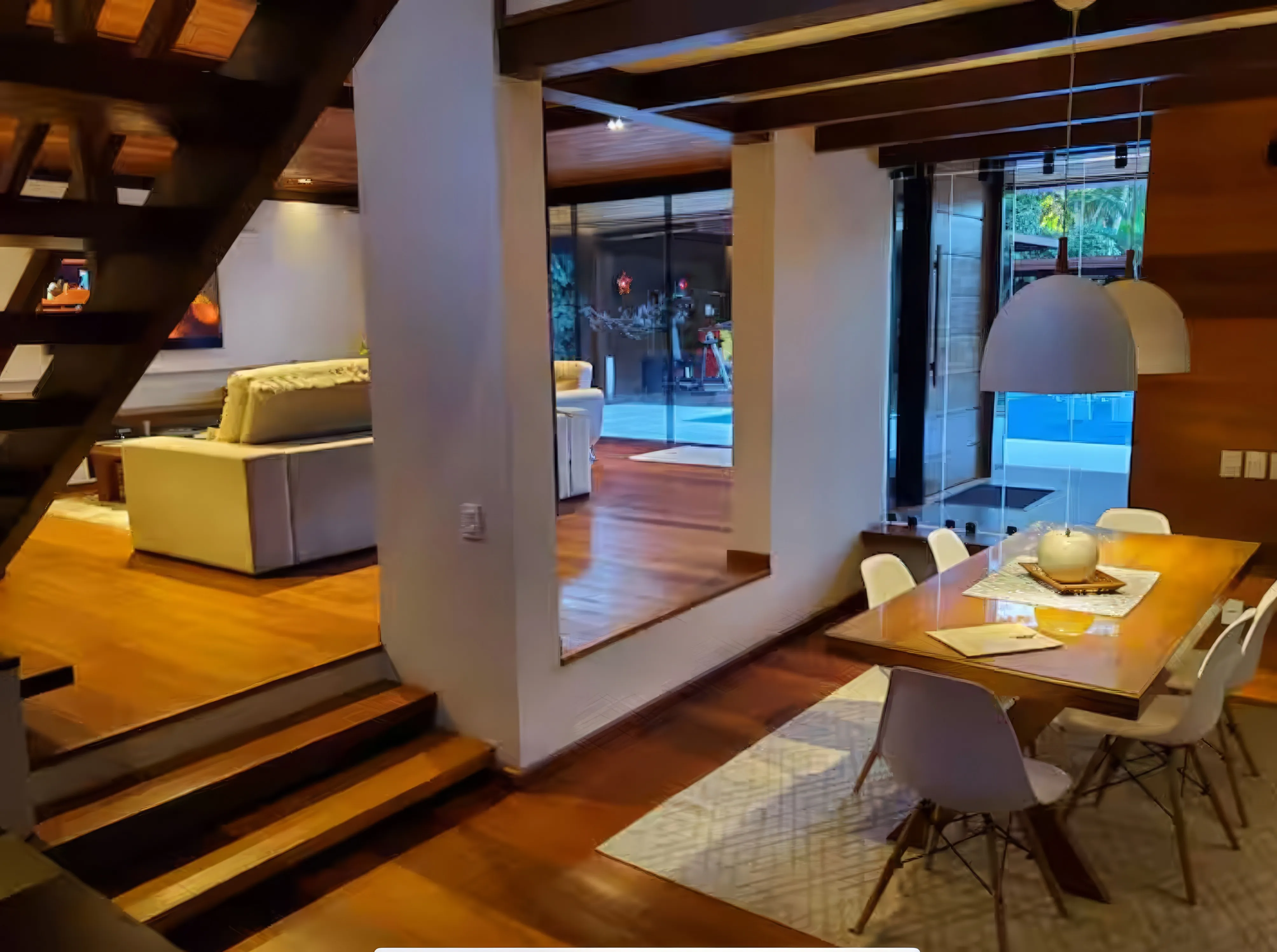 Espaço gourmet externo com churrasqueira a gás premium e forno de barro.